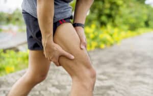Man experiencing severe thigh pain after a possible femur fracture.